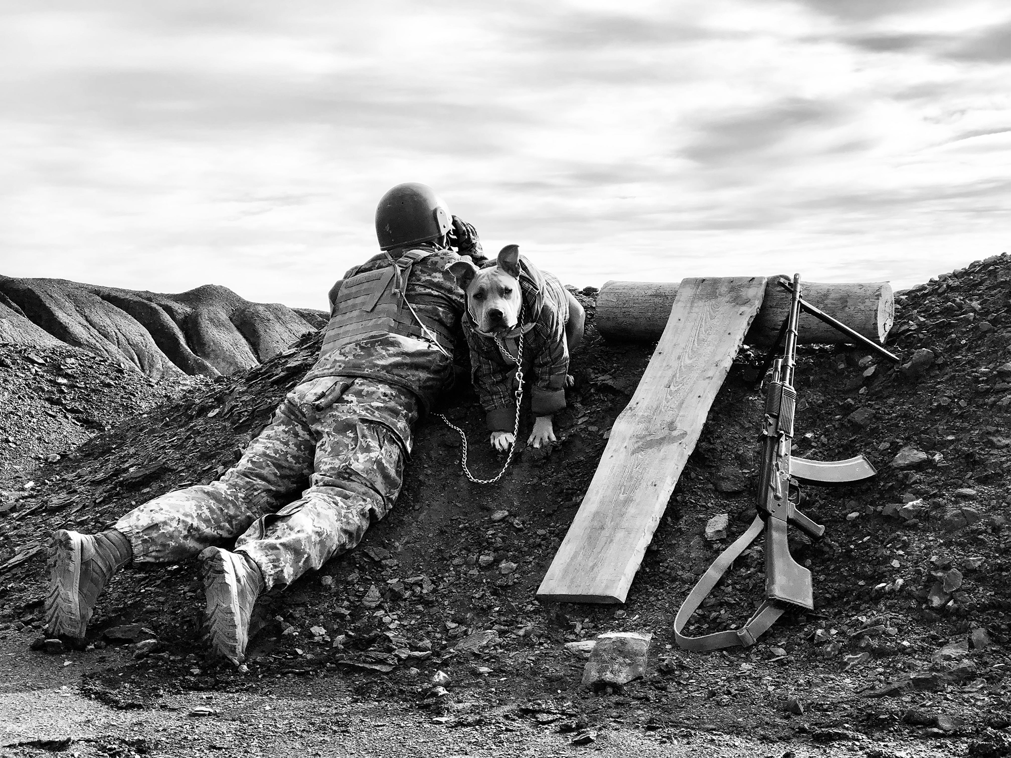Photo of a soldier with a dog.